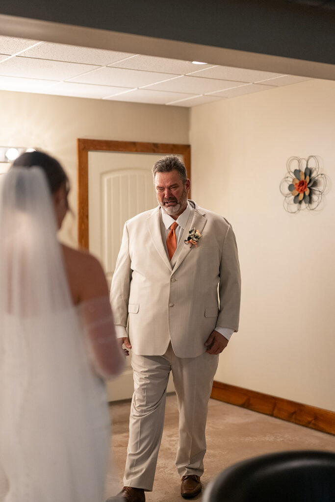 Emotional first look with bride and father of the bride