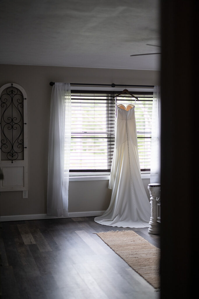 Brides wedding dress hanging