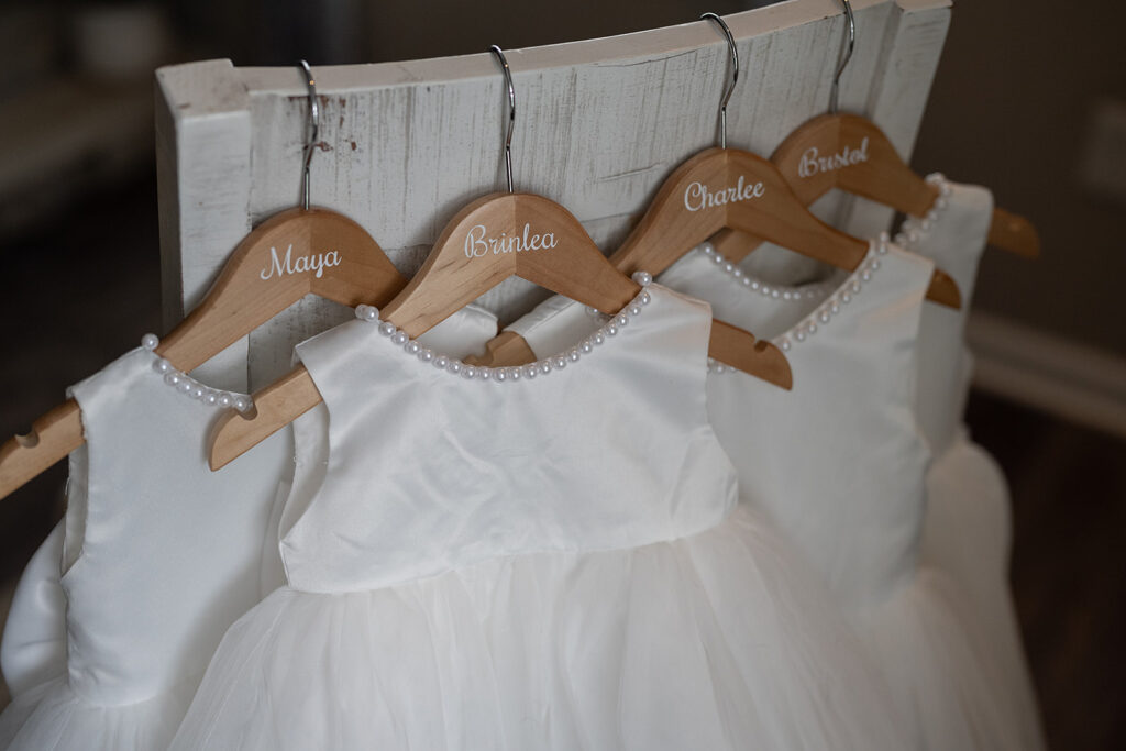 Matching flower girl dresses hanging