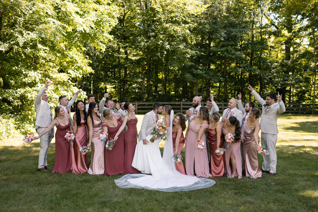 Full wedding party photos outside of Stone Creek Lodge wedding venue in Indiana