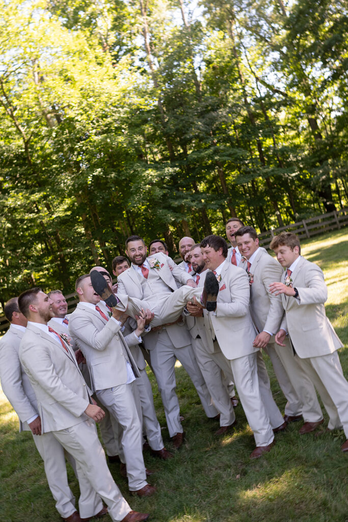 Outdoor groom and groomsmen photos from a Stone Creek Lodge wedding in Crawfordsville, Indiana