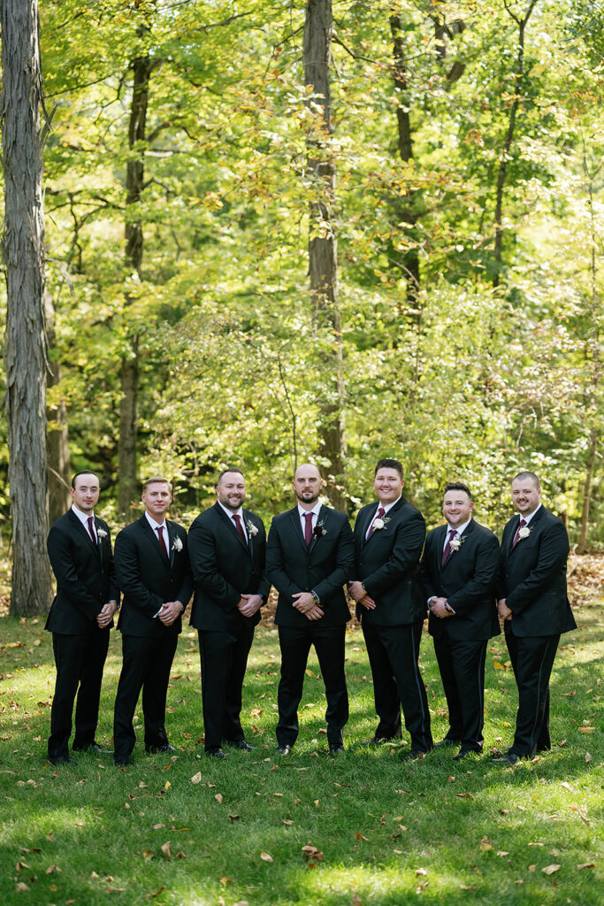 Outdoor fall groom and groomsmen portraits from a Rita Charles wedding in Indianapolis, Indiana