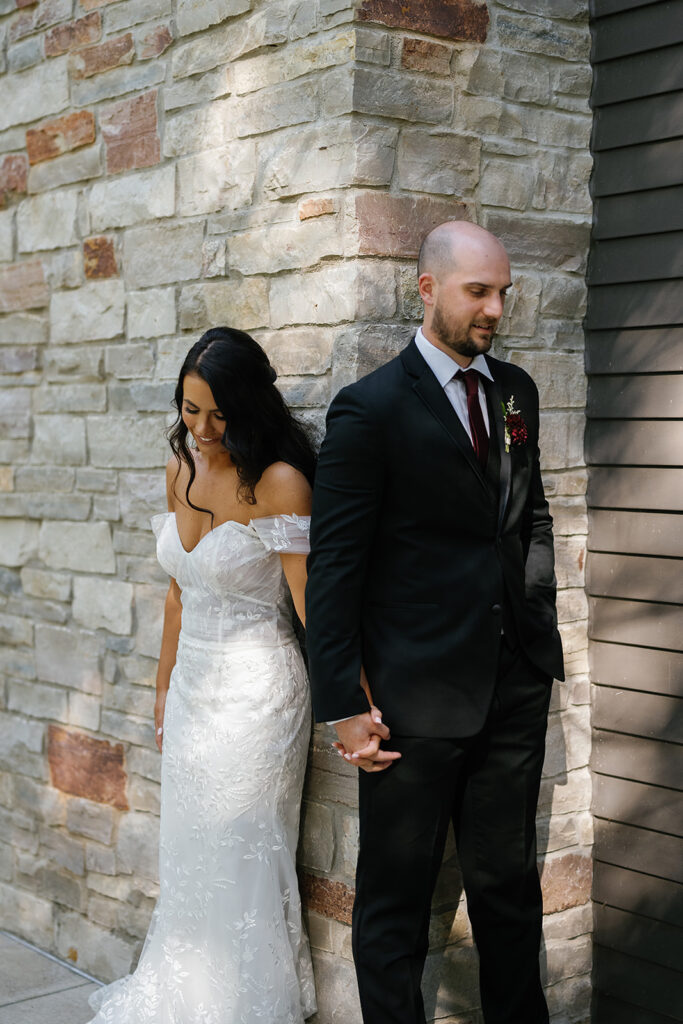 Bride and groom sharing a first touch