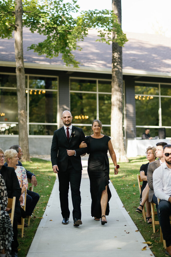 Groom walked down the aisle with his mother