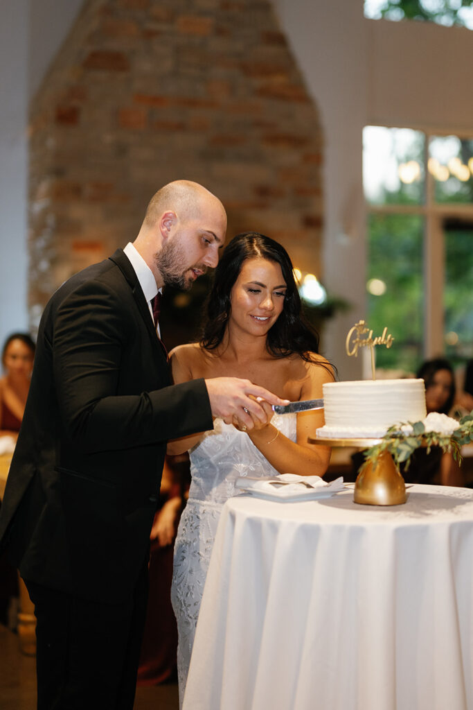 Bride and groom cutting their wedding cake