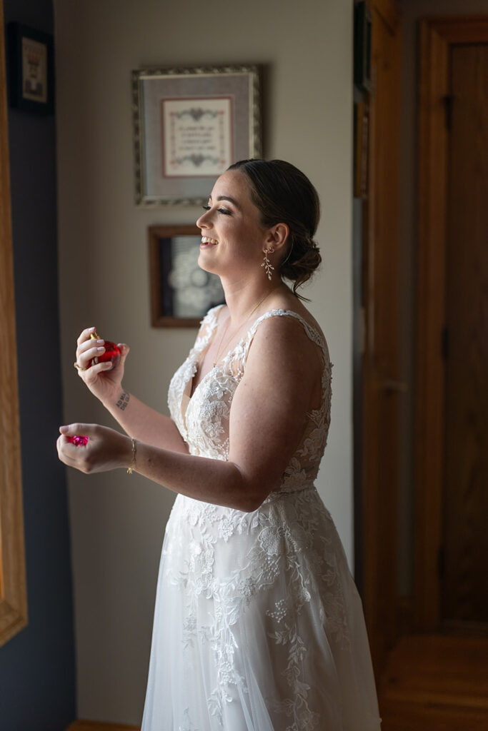 Bride spritzing herself with perfume 