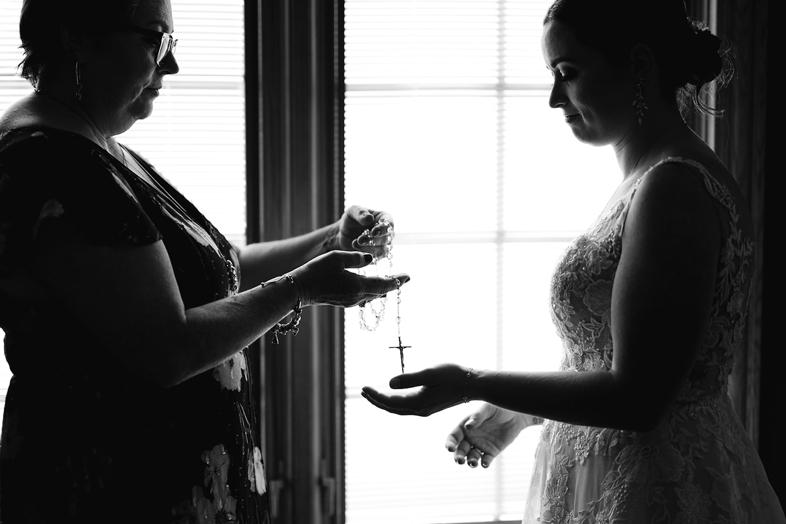 Brides mother handing her a rosary