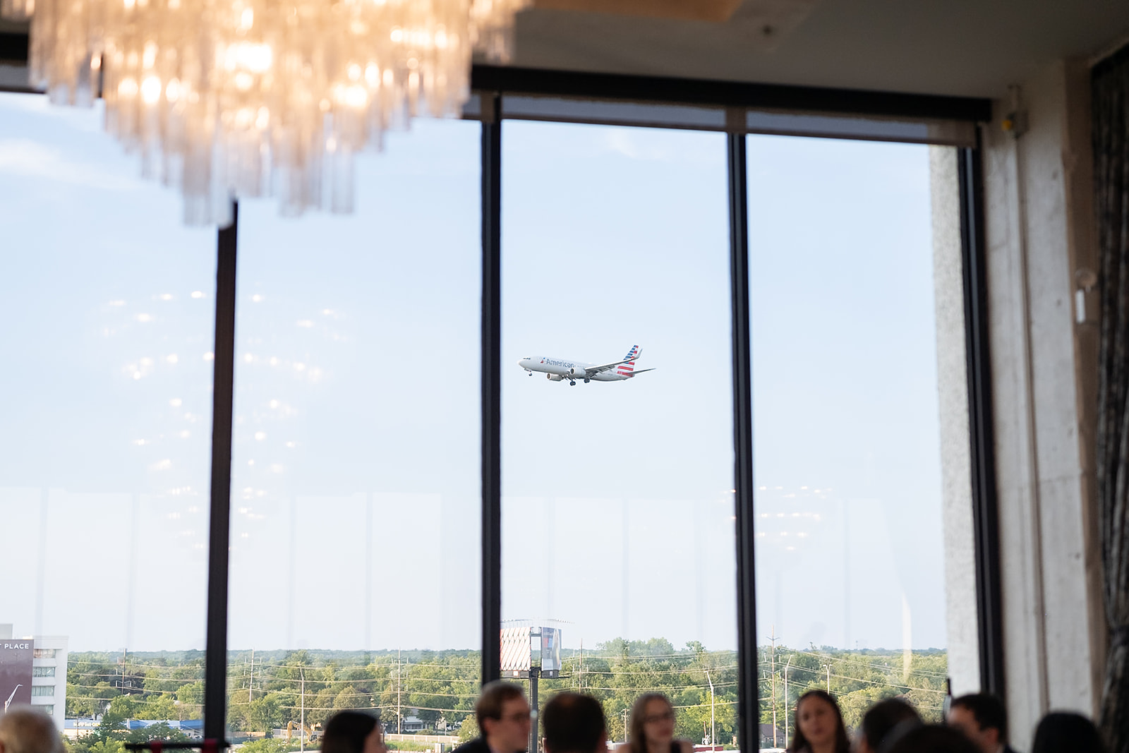 Airplane flying in from O'Hare Airport in Chicago during a Sky on Nine wedding reception