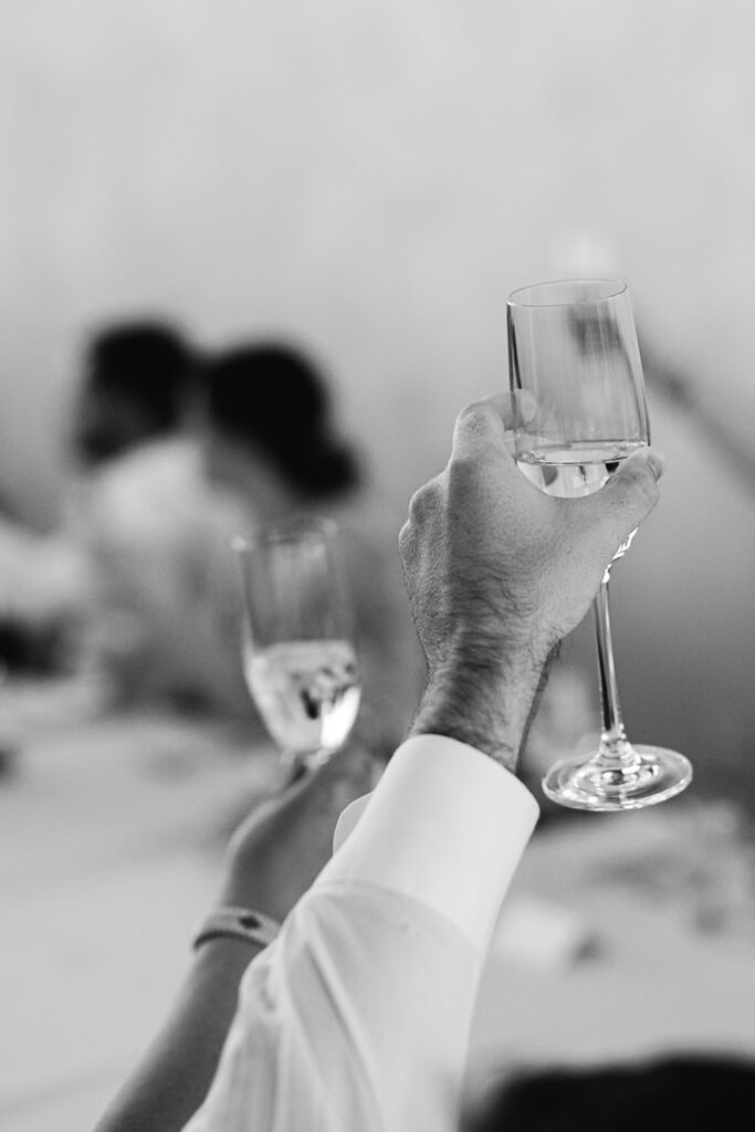 Black and white photo of guests toasting