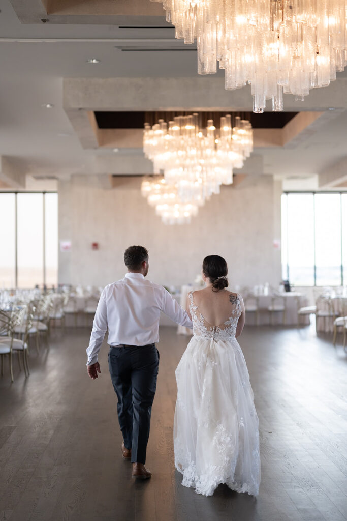 Bride and groom seeing their indoor Sky on Nine wedding reception in Chicago, Illinois