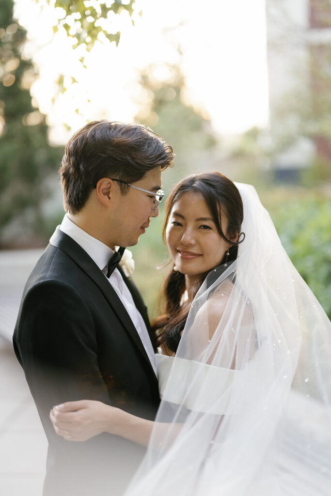 Bride and groom posing outdoors for their Greenhouse Loft Chicago wedding portraits