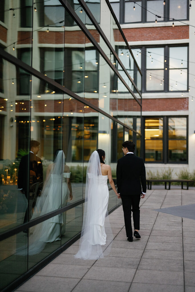 Bride and groom posing outdoors for their Greenhouse Loft Chicago wedding portraits