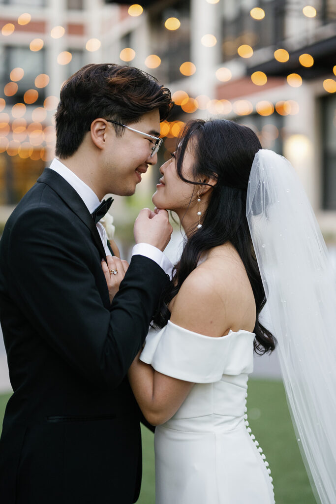 Bride and groom posing outdoors for their Greenhouse Loft Chicago wedding portraits