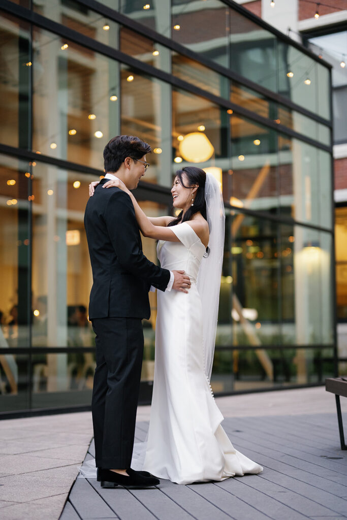 Bride and groom posing outdoors for their Greenhouse Loft Chicago wedding portraits