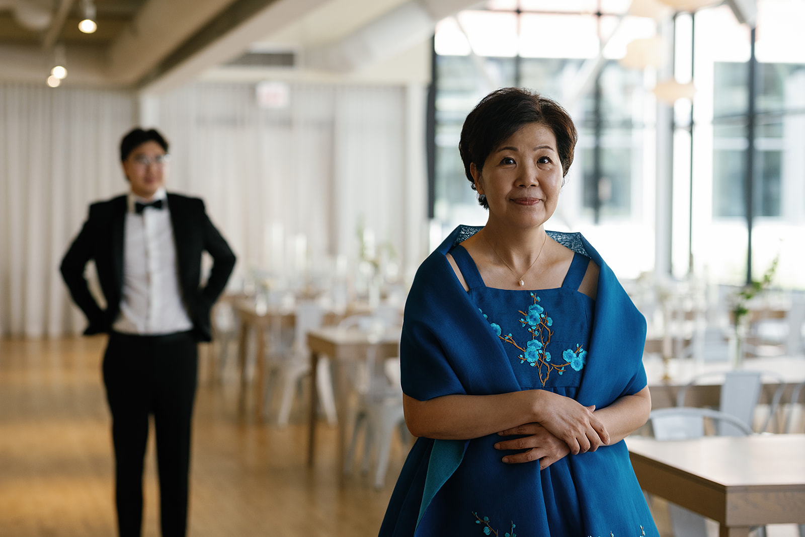 Groom sharing a first look with his mother during his Greenhouse Loft Chicago wedding