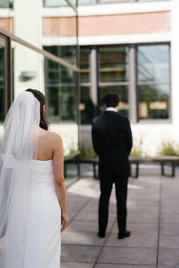 Bride and groom sharing a first look outdoors for their Greenhouse Loft Chicago wedding