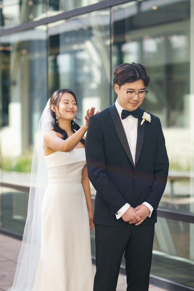 Bride and groom sharing a first look outdoors for their Greenhouse Loft Chicago wedding