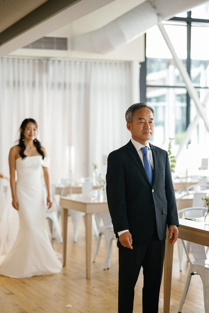 Bride sharing a first look with her father for her Greenhouse Loft Chicago wedding