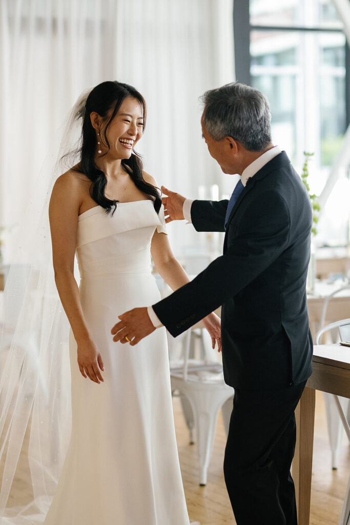 Bride sharing a first look with her father for her Greenhouse Loft Chicago wedding