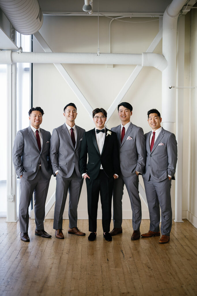 Indoor groom and groomsmen portraits from a Greenhouse Loft Chicago wedding