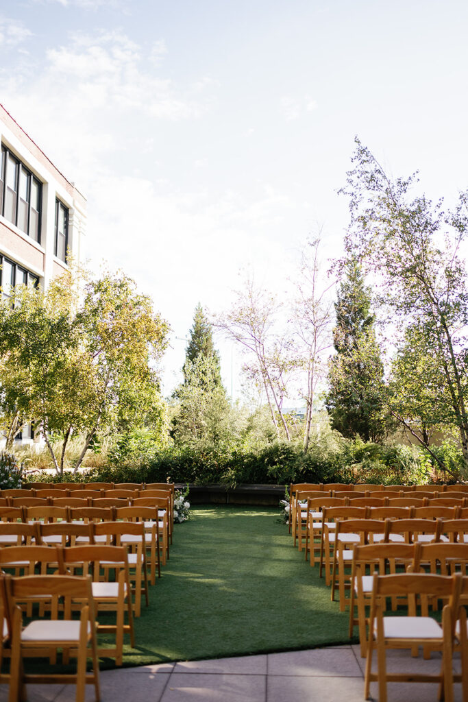 An outdoor Greenhouse Loft Chicago wedding ceremony in the sky garden