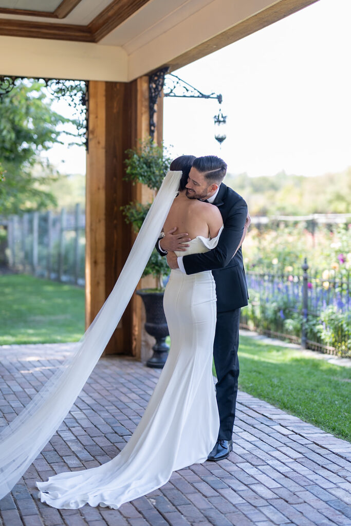 Bride and groom hugging after their first look