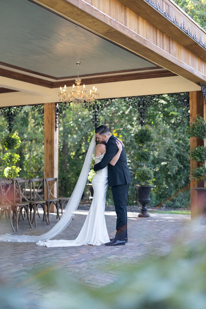 Bride and groom hugging after their first look