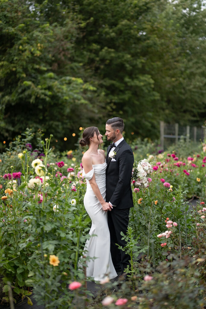 Bride and grooms portraits in the gardens at Artisan Acres Estate wedding venue