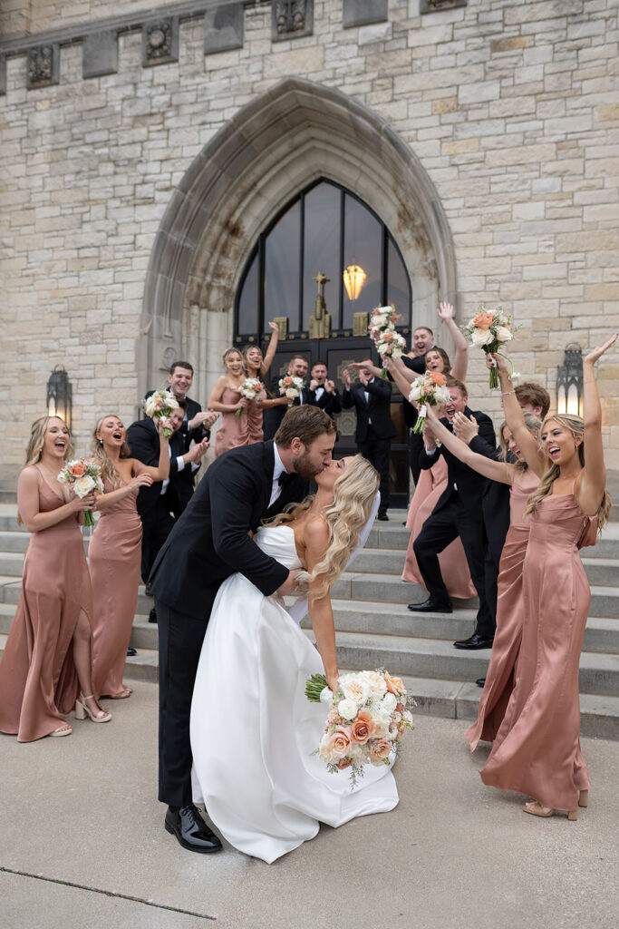 Bride and grooms church exit after their Immaculate Conception Fort Wayne wedding ceremony