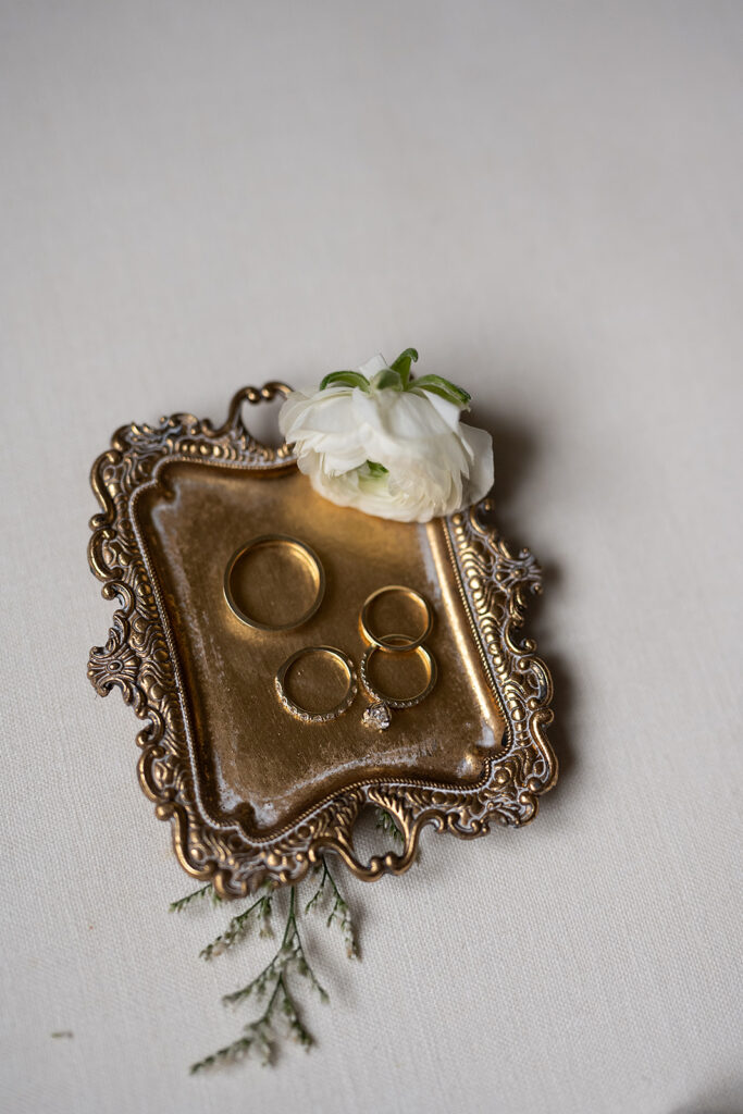 Flatlay shot of rings in a dish