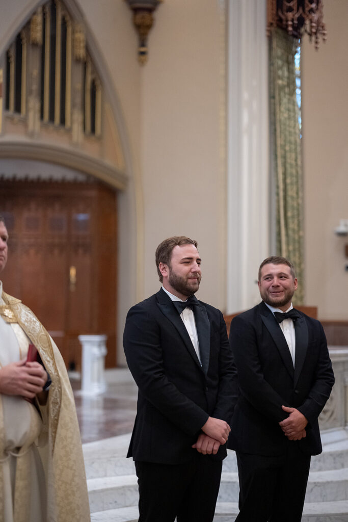 Groom getting emotional as he watches his bride walking down the aisle