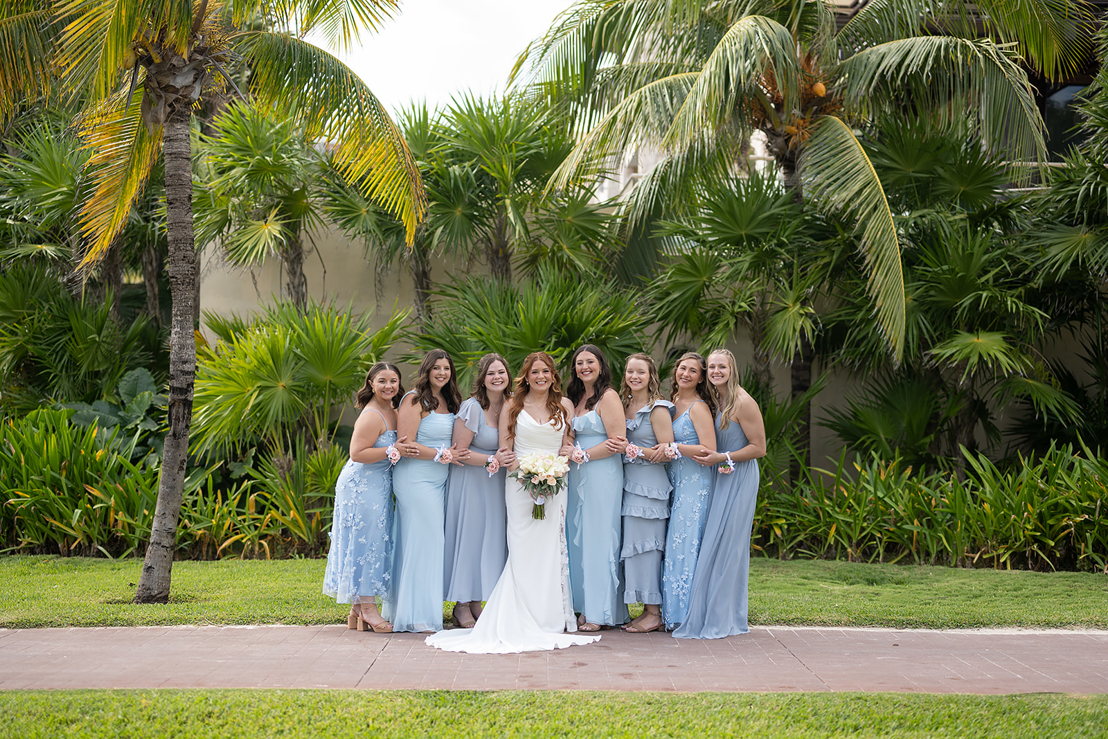 Outdoor bride and bridesmaids photos from a Royalton Riviera Cancun wedding