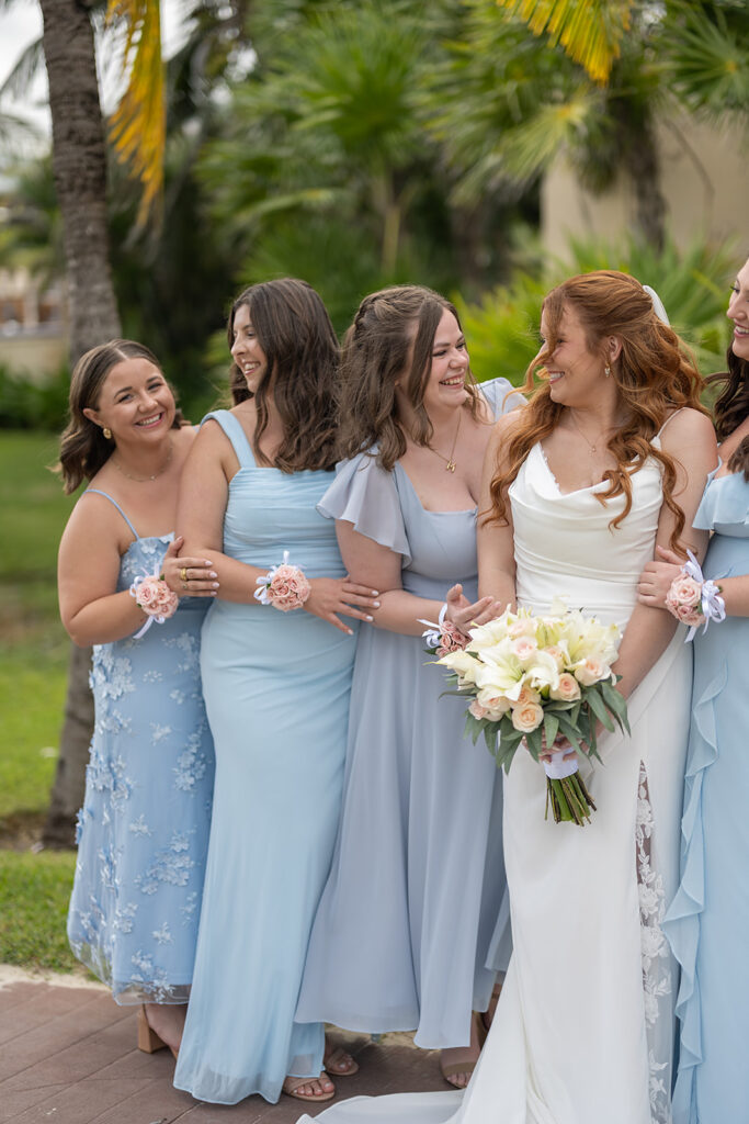 Outdoor bride and bridesmaids photos from a Royalton Riviera Cancun wedding