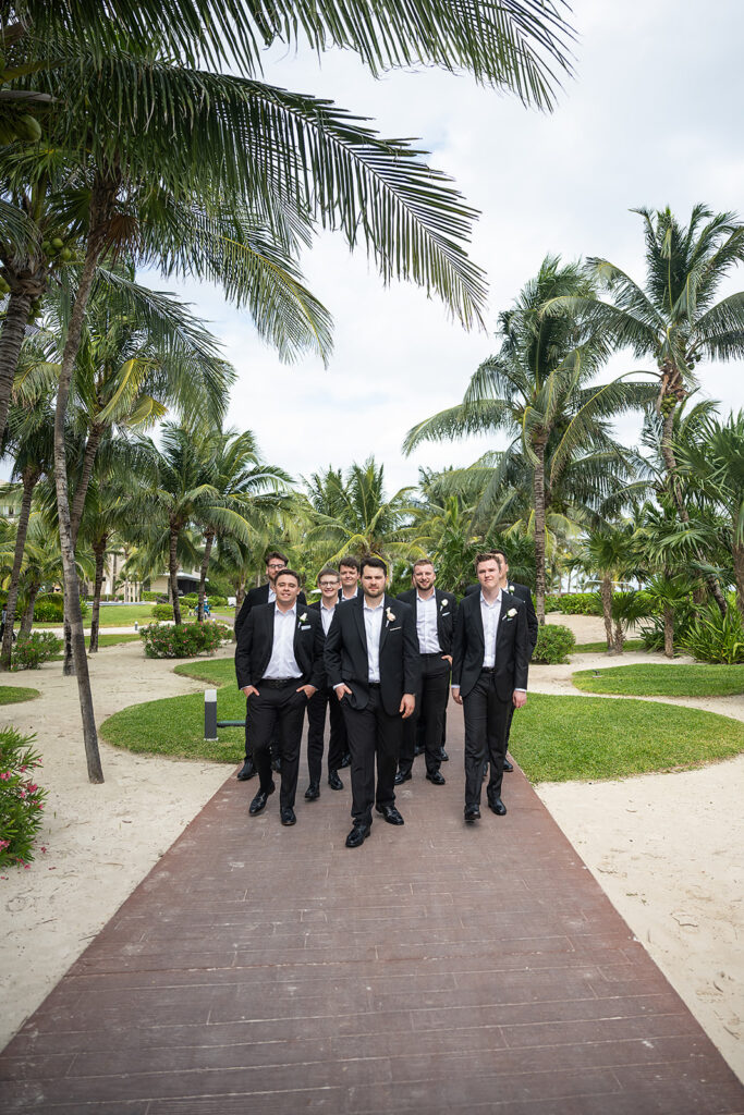 Outdoor groom and groomsmen photos from a Royalton Riviera Cancun wedding