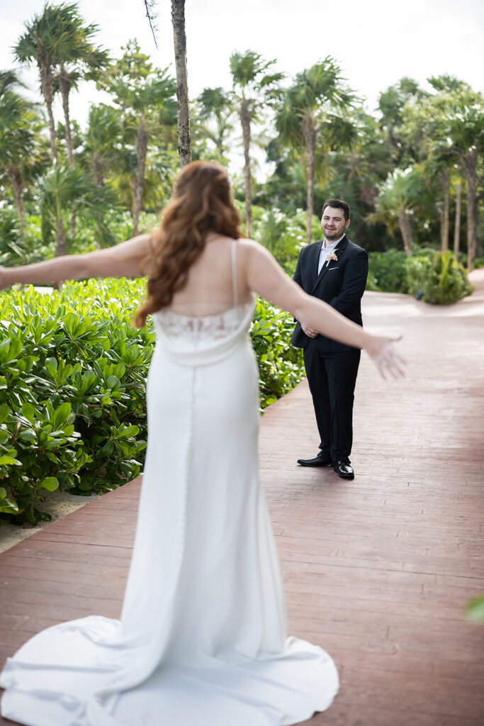 Bride and groom sharing a first look during their destination Royalton Riviera Cancun Wedding