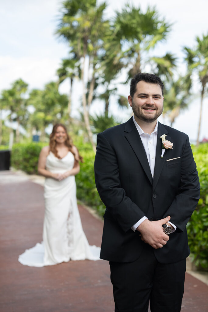 Bride and groom sharing a first look during their destination Royalton Riviera Cancun Wedding