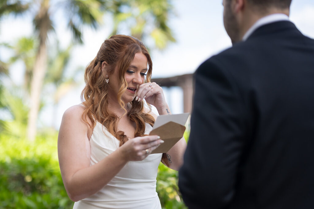 Bride and groom exchanging vows during their destination Royalton Riviera Cancun Wedding