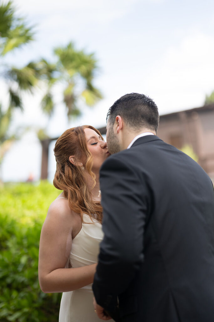 Bride and groom kissing during their first looks
