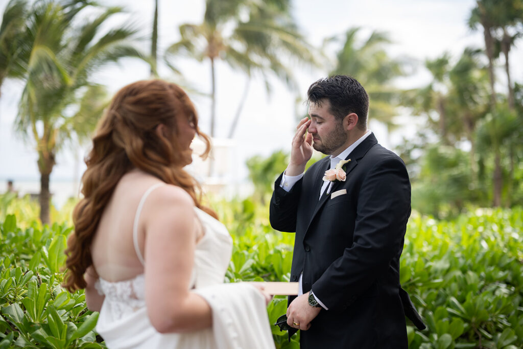 Bride and groom exchanging vows during their destination Royalton Riviera Cancun Wedding