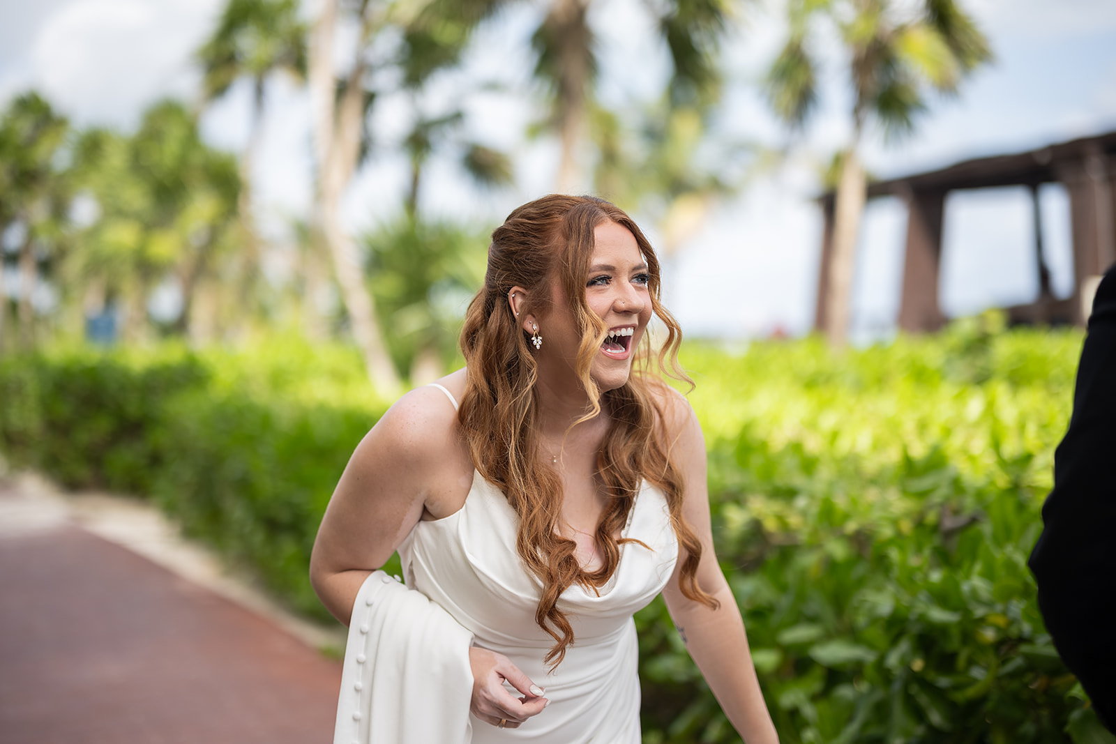 Candid wedding photo of a bride laughing
