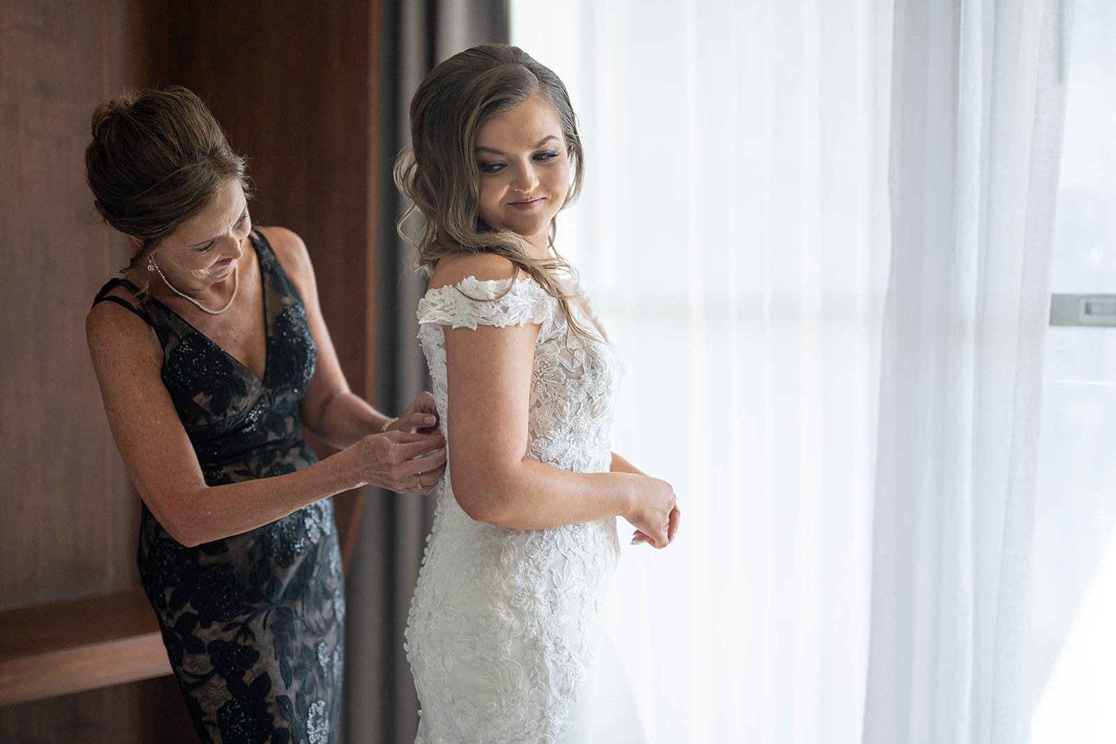 Bride getting ready with her mother
