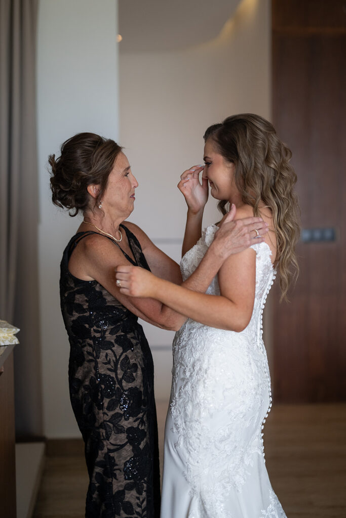 Mother and bride getting emotional after gift exchange