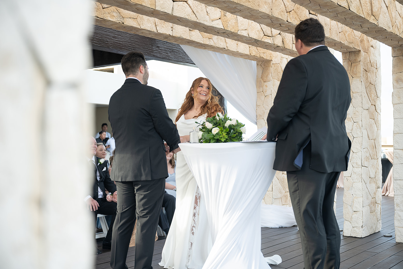 Bride and groom standing at the altar for their Sky Wedding ceremony at Hideaway at Royalton Riviera Cancun