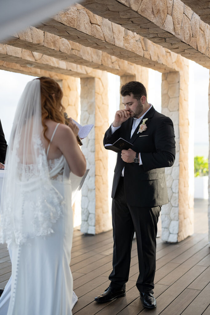 Bride and groom exchanging vows during their Sky Wedding ceremony at Hideaway at Royalton Riviera Cancun