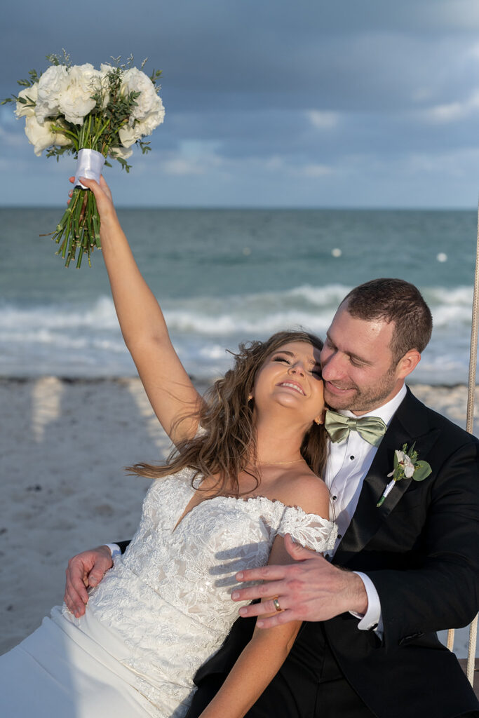Bride and grooms portraits on the beach from their Grand Palladium Costa Mujeres wedding on the beach