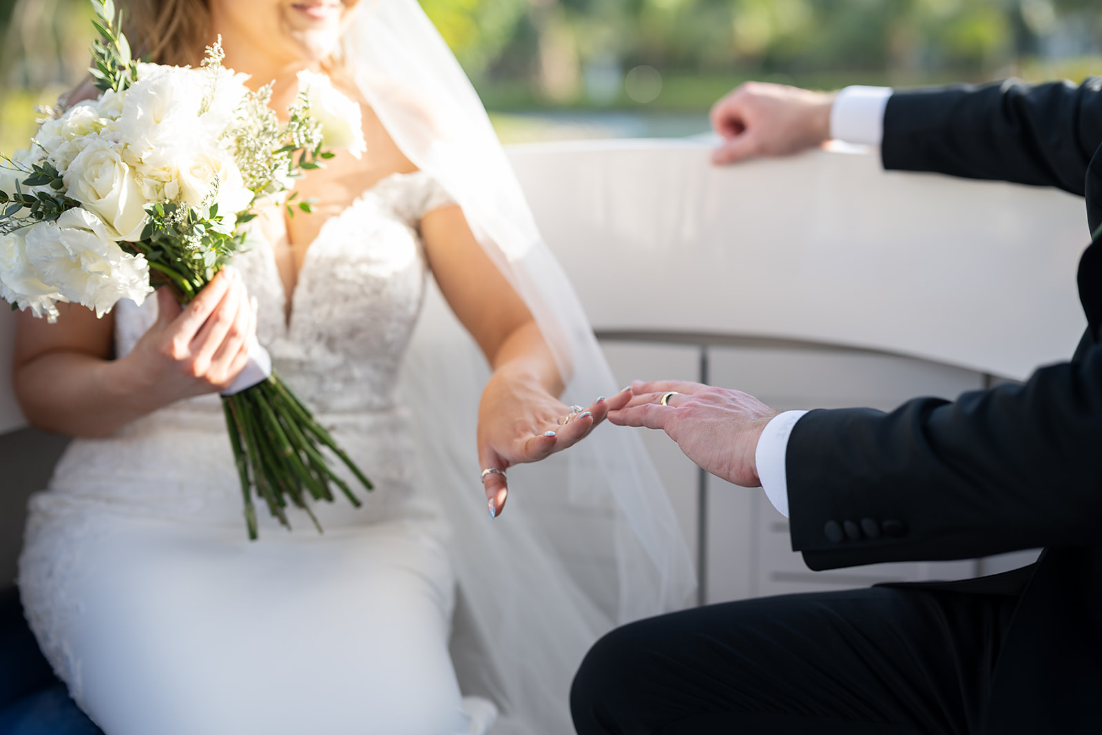Bride and groom admiring their wedding rings