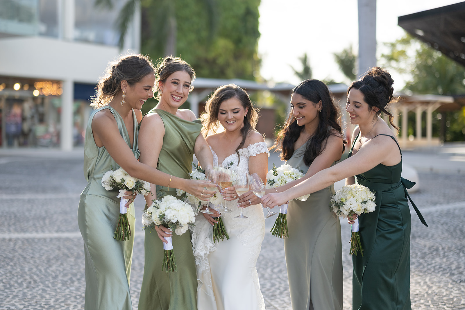 Bride and her bridesmaids toasting champagne