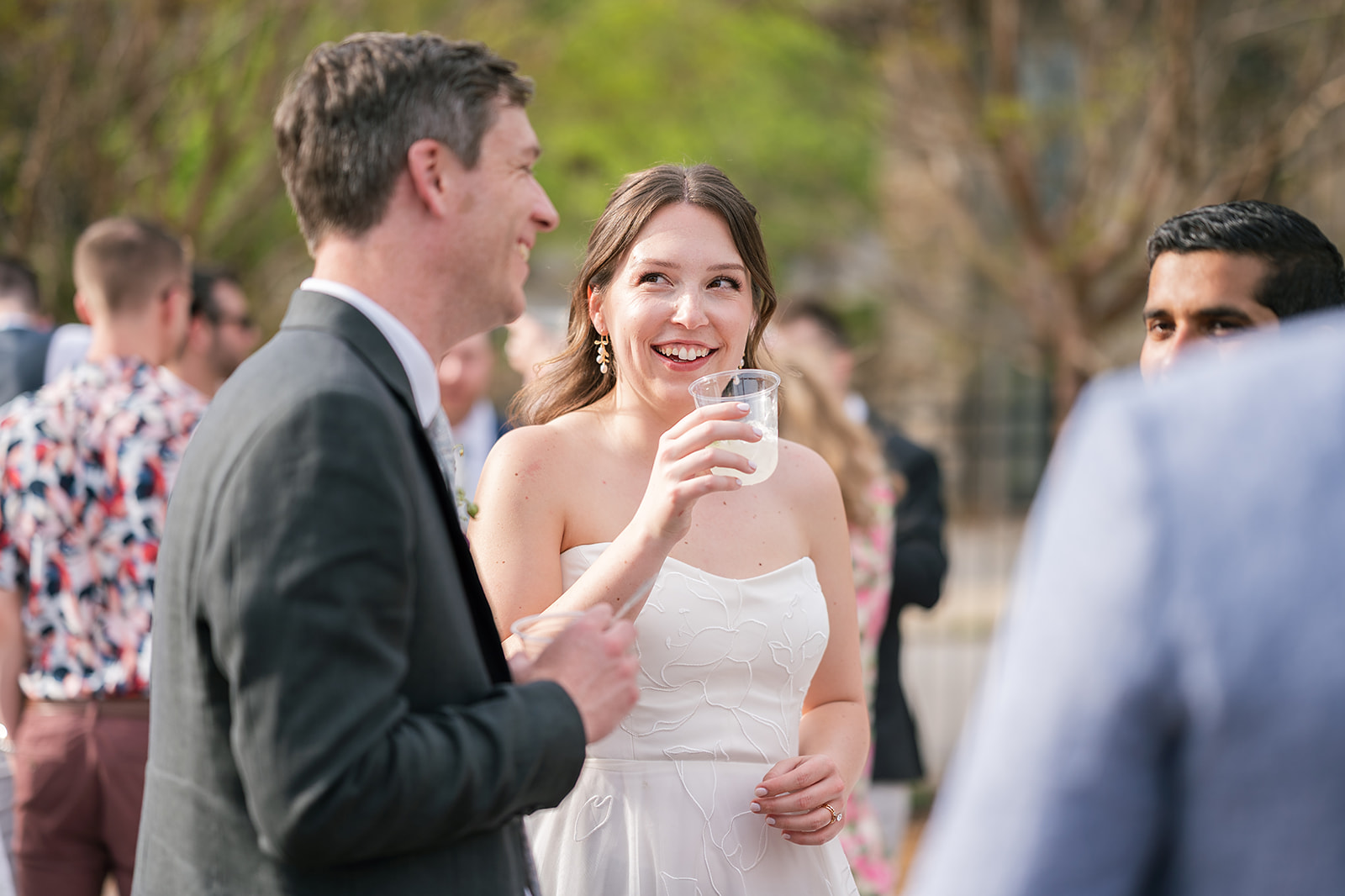 Bride and groom mingling during cocktail hour
