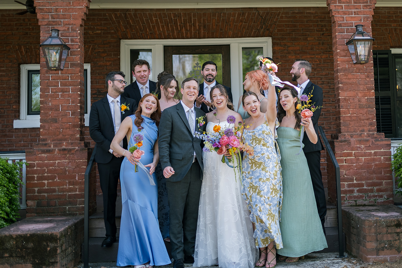 Full wedding party photo outside of The Bunn House in Asheville, North Carolina