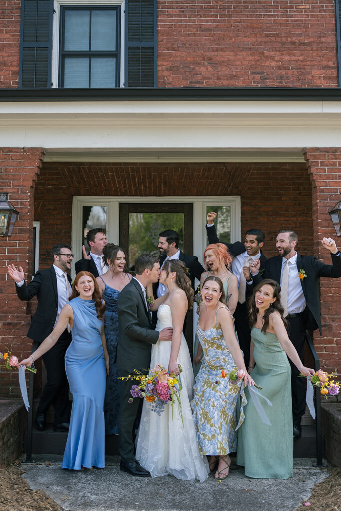 Full wedding party photo outside of The Bunn House in Asheville, North Carolina